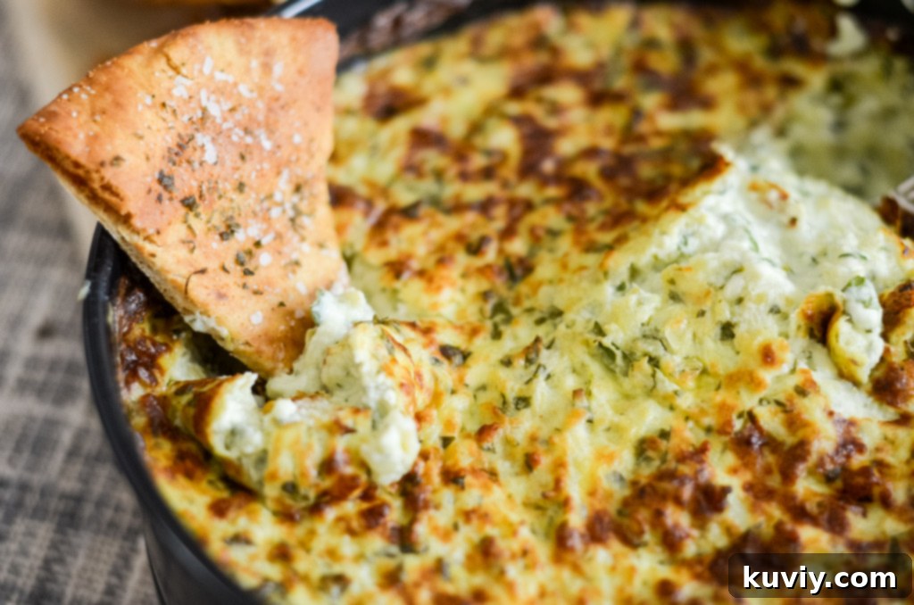 Leftover air fryer spinach dip stored in an airtight container for future enjoyment, emphasizing proper food storage.