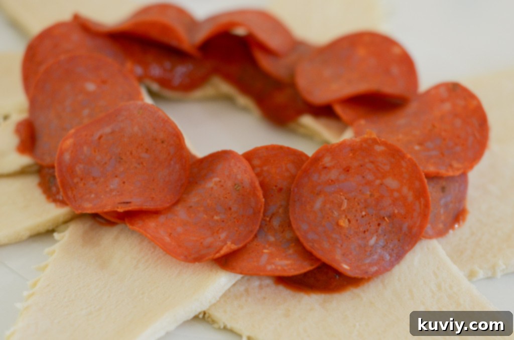 Ingredients for air fryer pizza ring including crescent rolls, pizza sauce, pepperoni, and mozzarella cheese