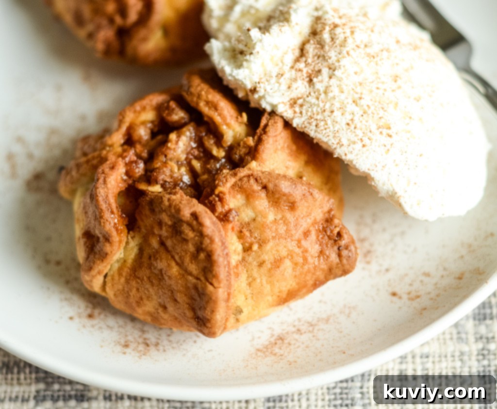 Air fryer apple blossoms served with ice cream and caramel drizzle