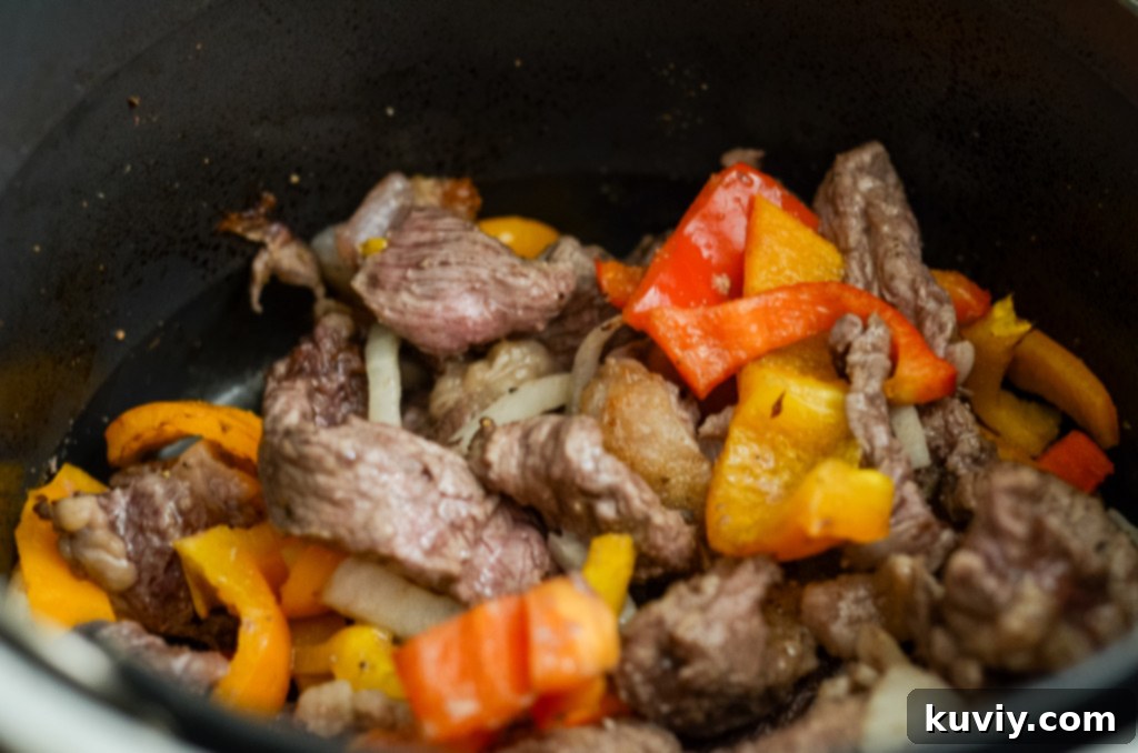 Cooking the steak and vegetables for egg rolls