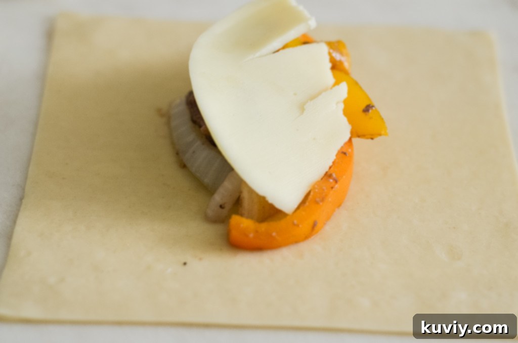 Assembling Air Fryer Philly Cheesesteak Egg Rolls