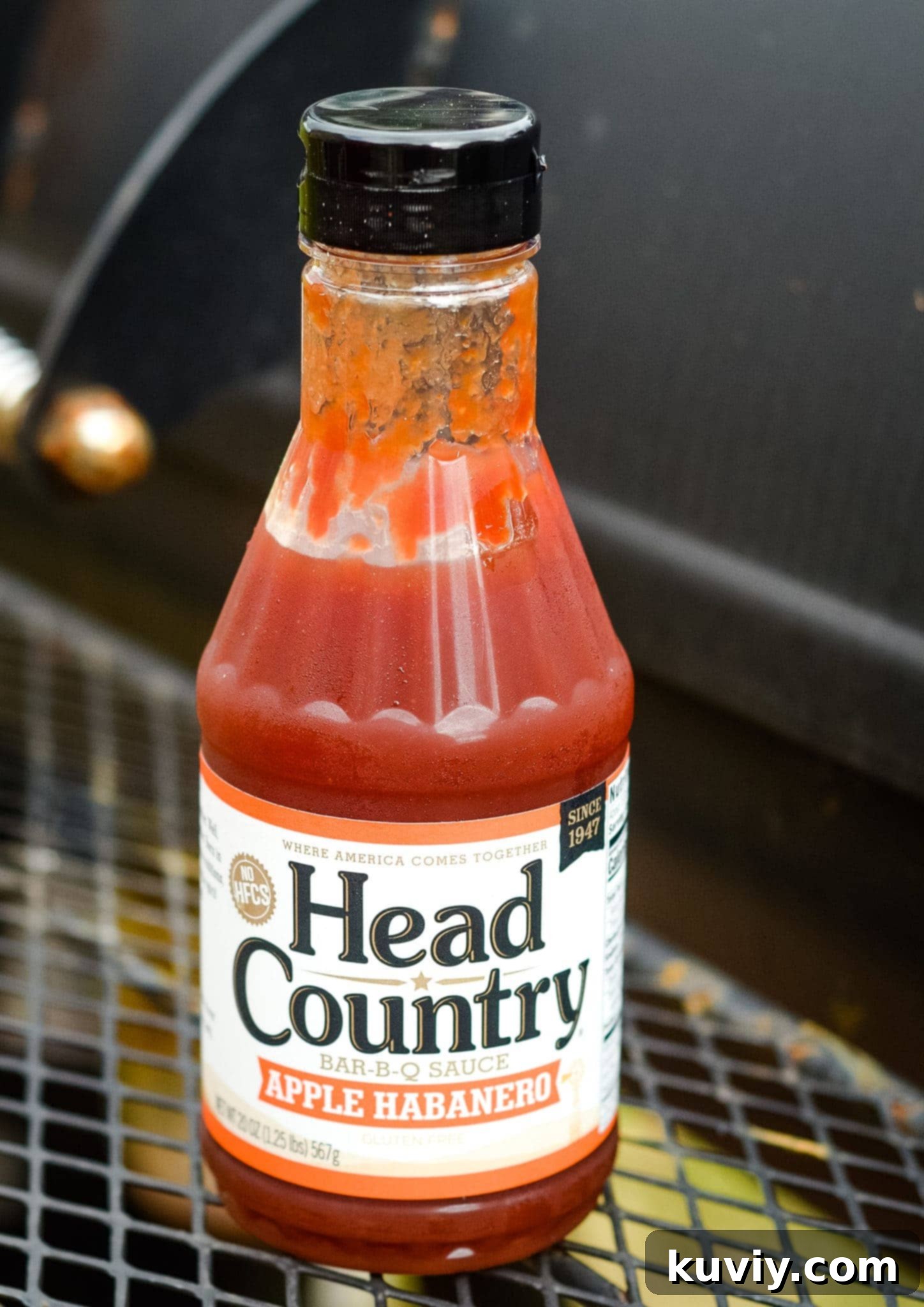 Air fryer basket filled with cooking chicken nuggets.