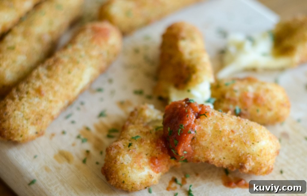 Air Fryer Frozen Mozzarella Sticks garnished with parsley