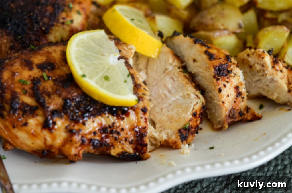 This image shows air fryer lemon pepper chicken, sliced and ready to eat.