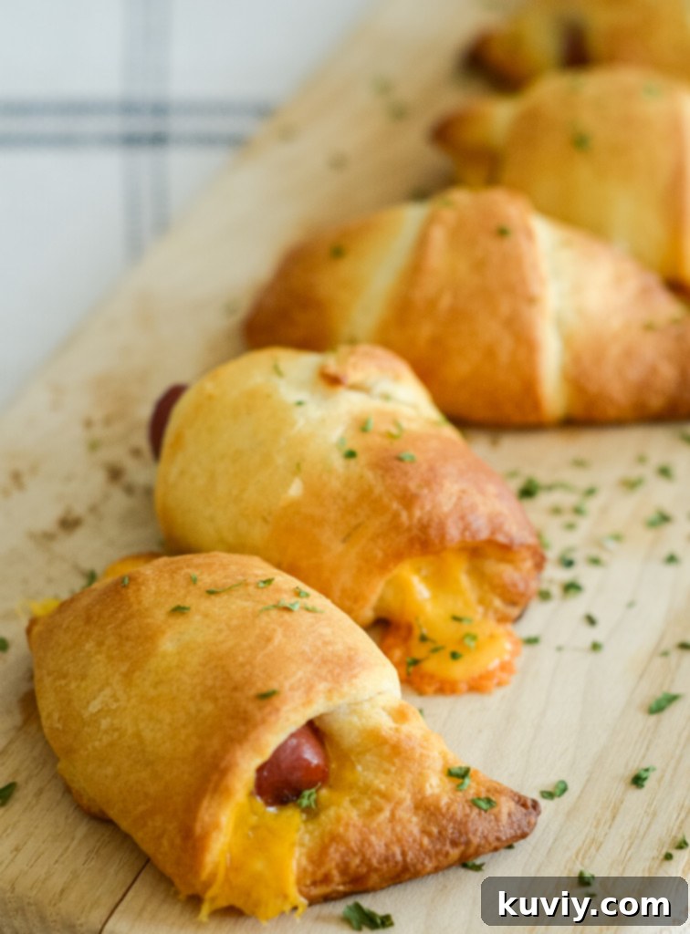 This image shows air fryer pigs in a blanket with cheese made in 8 minutes in the air fryer.
