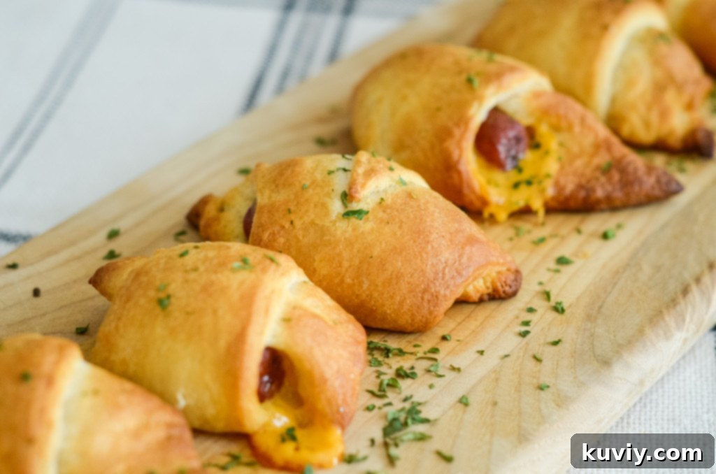 This image shows air fryer pigs in a blanket with cheese.