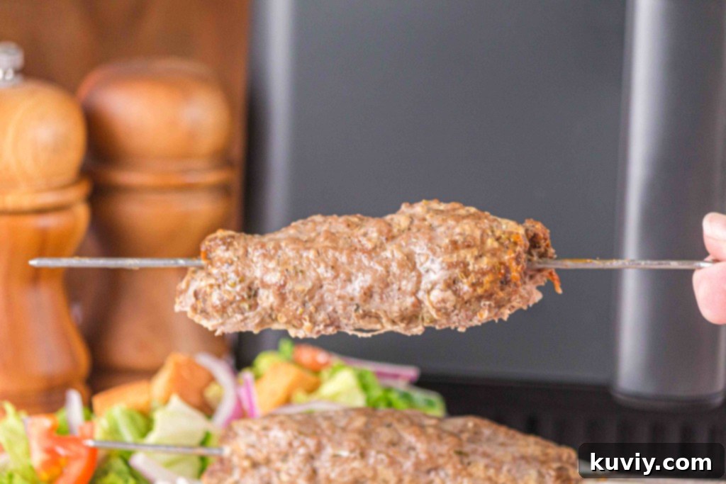 Air Fryer Ground Beef Kebabs on a plate with garnishes