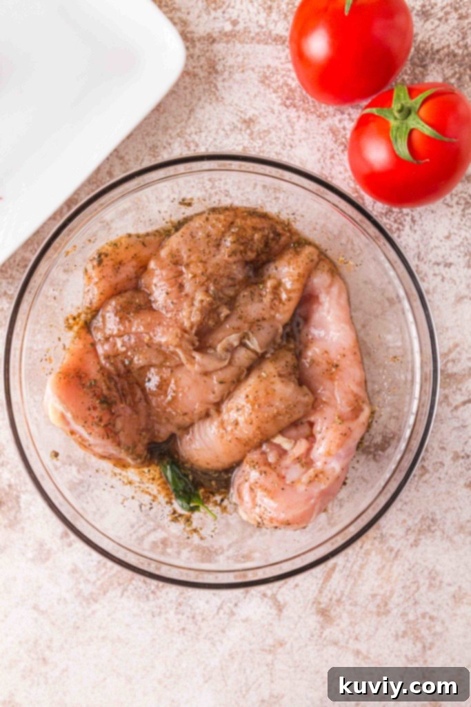 Fresh ingredients for Gluten-Free Air Fryer Caprese Chicken, including basil, mozzarella, and tomatoes