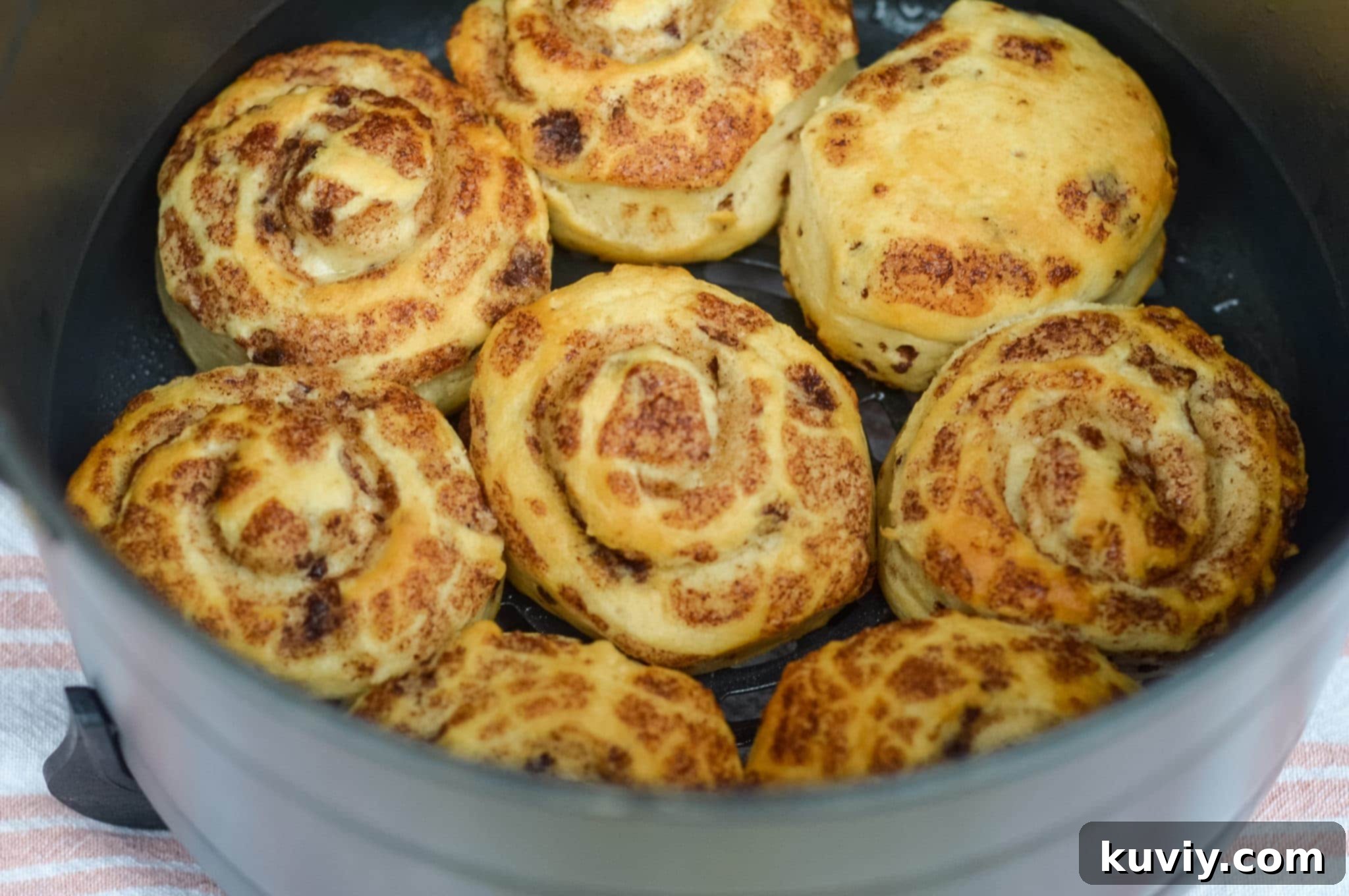 plate of air fryer cinnamon rolls ready to be served