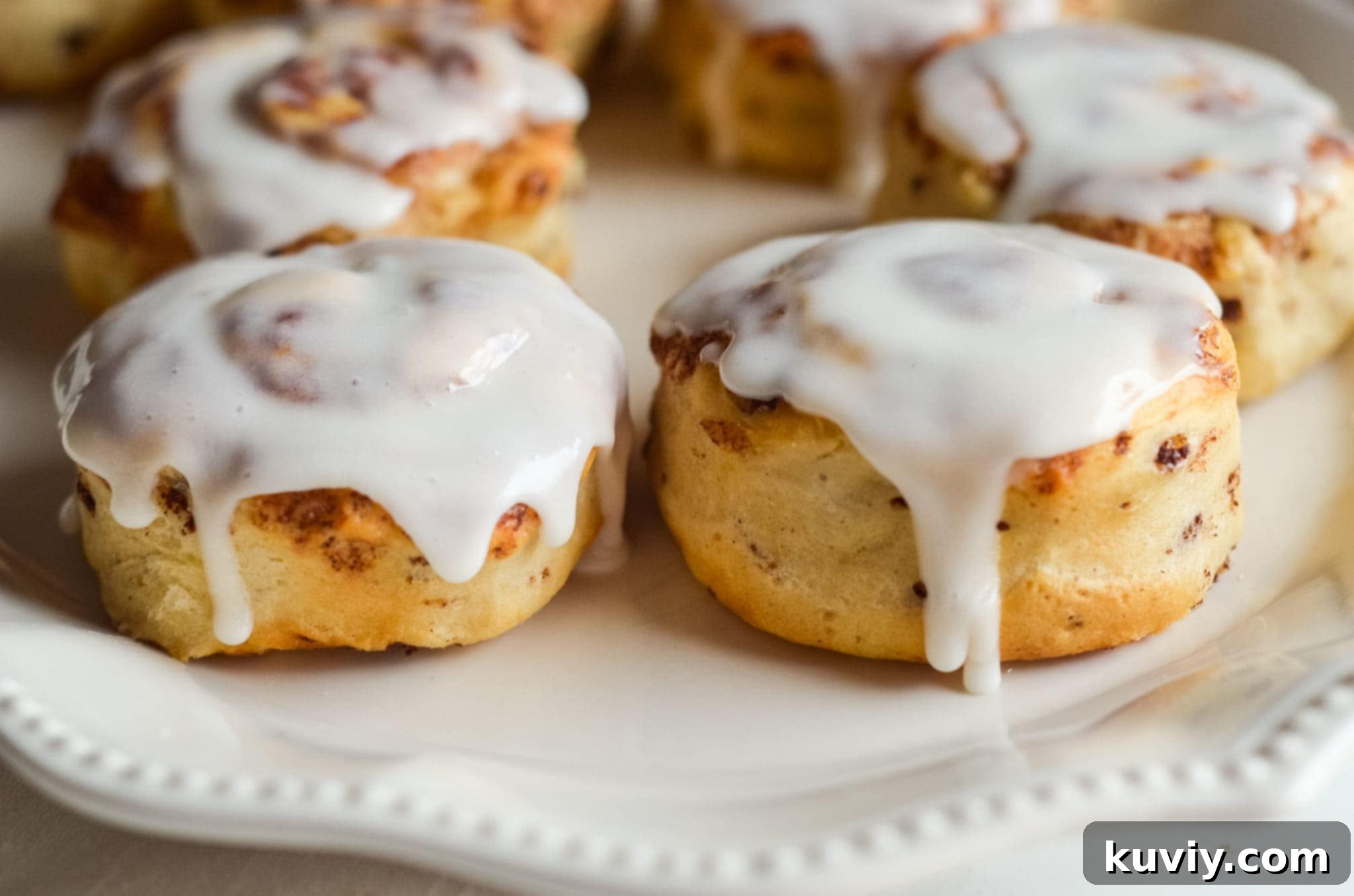 air fryer basket with uncooked cinnamon rolls