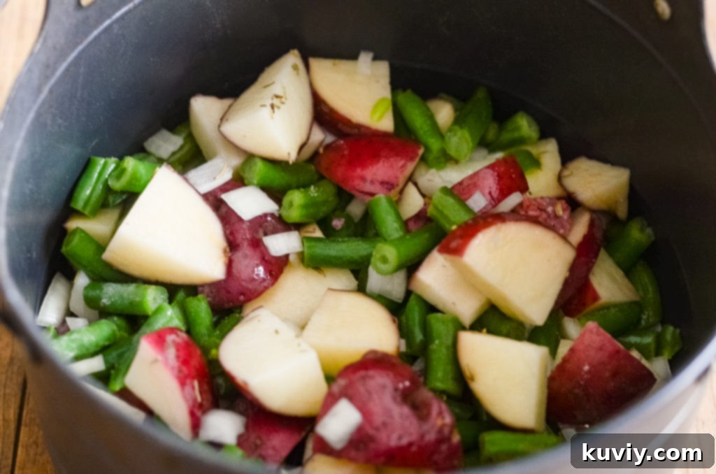Hobo Dinner Foil Packets cooking over a campfire