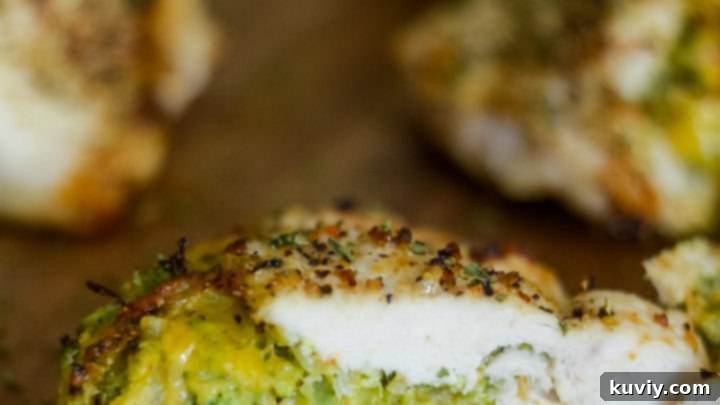 Golden brown Air Fryer Stuffed Chicken Breast, sliced to reveal its filling.