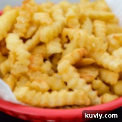 Easy Air Fryer Frozen French Fries: Crispy Perfection 6 Air fried golden french fries in a serving bowl