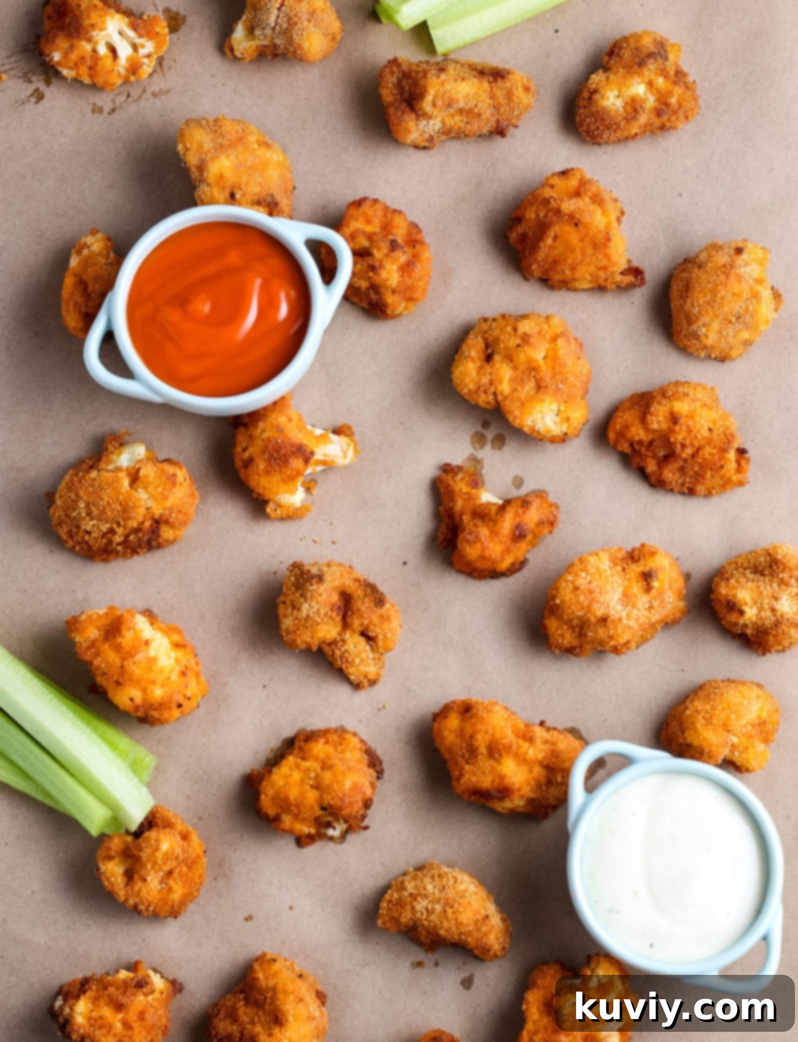 Air Fryer Buffalo Cauliflower Wings cooking in the basket