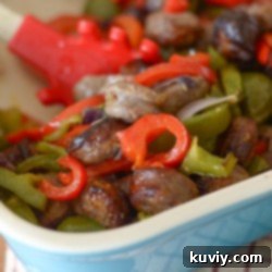 A perfectly cooked plate of Air Fryer Bratwurst and Vegetables, showcasing vibrant colors and crispy textures.