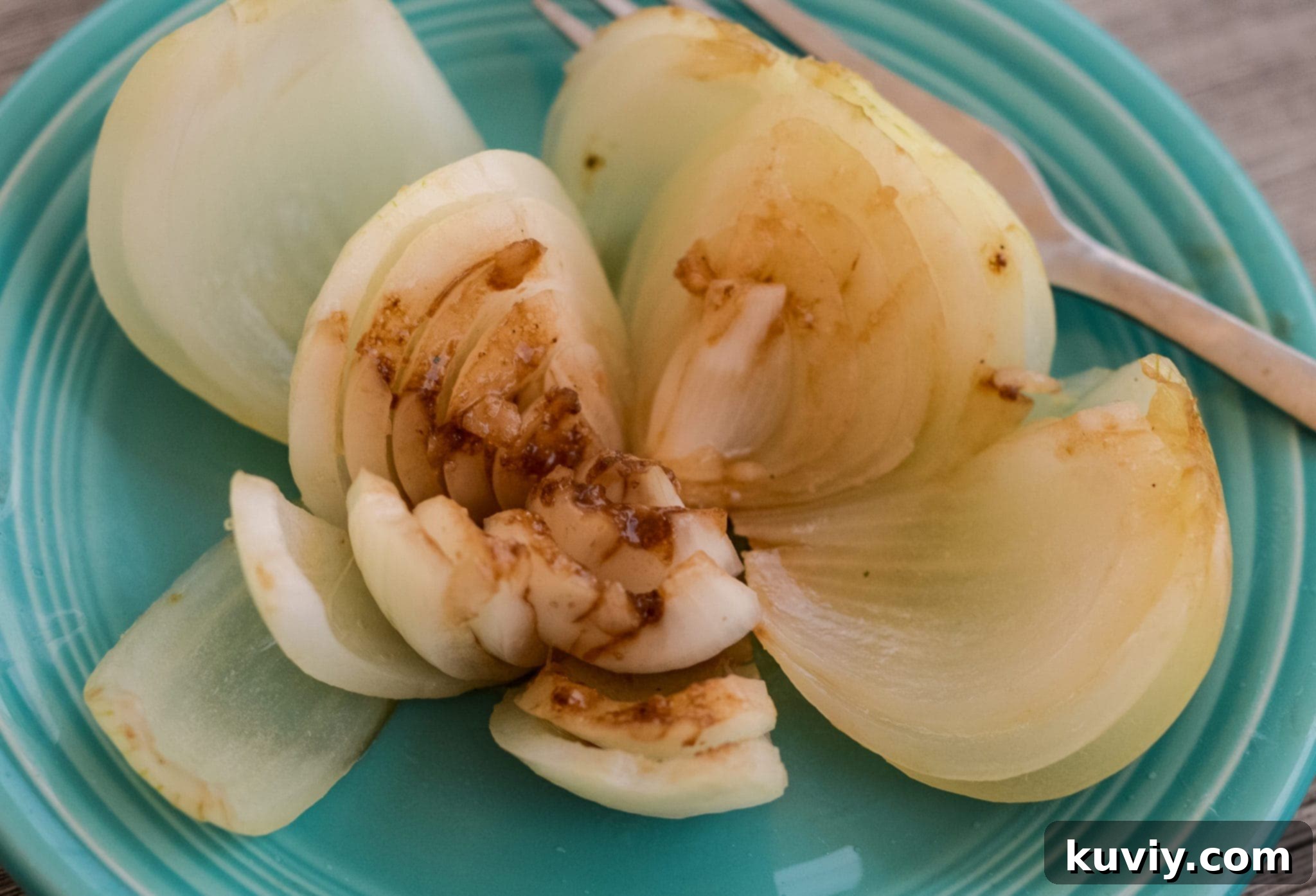 Close-up of a cooked Air Fryer Vidalia Onion, showing its soft and juicy interior.
