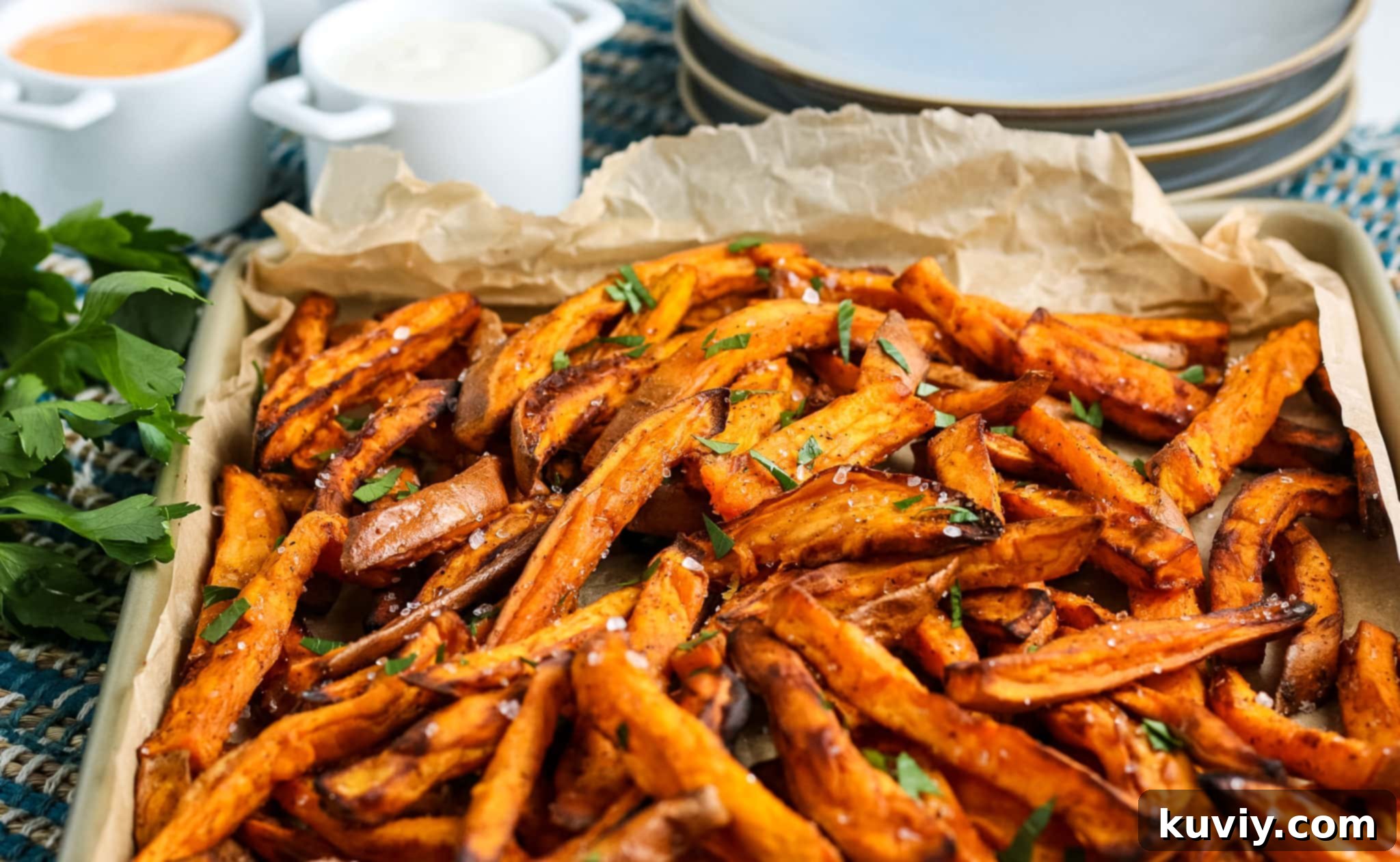 Air fried sweet potato fries in an air fryer basket