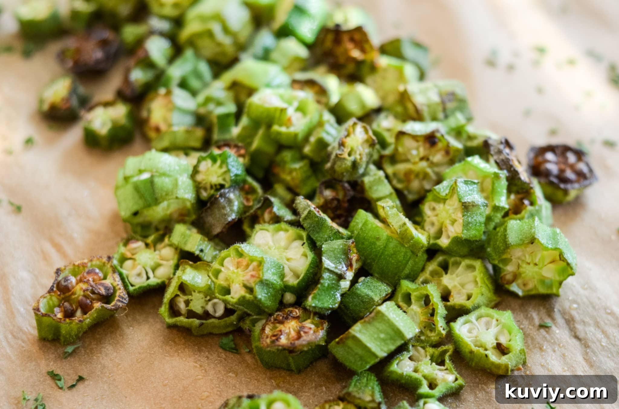 Air Fryer Roasted Okra cooking in an air fryer basket, showing texture.