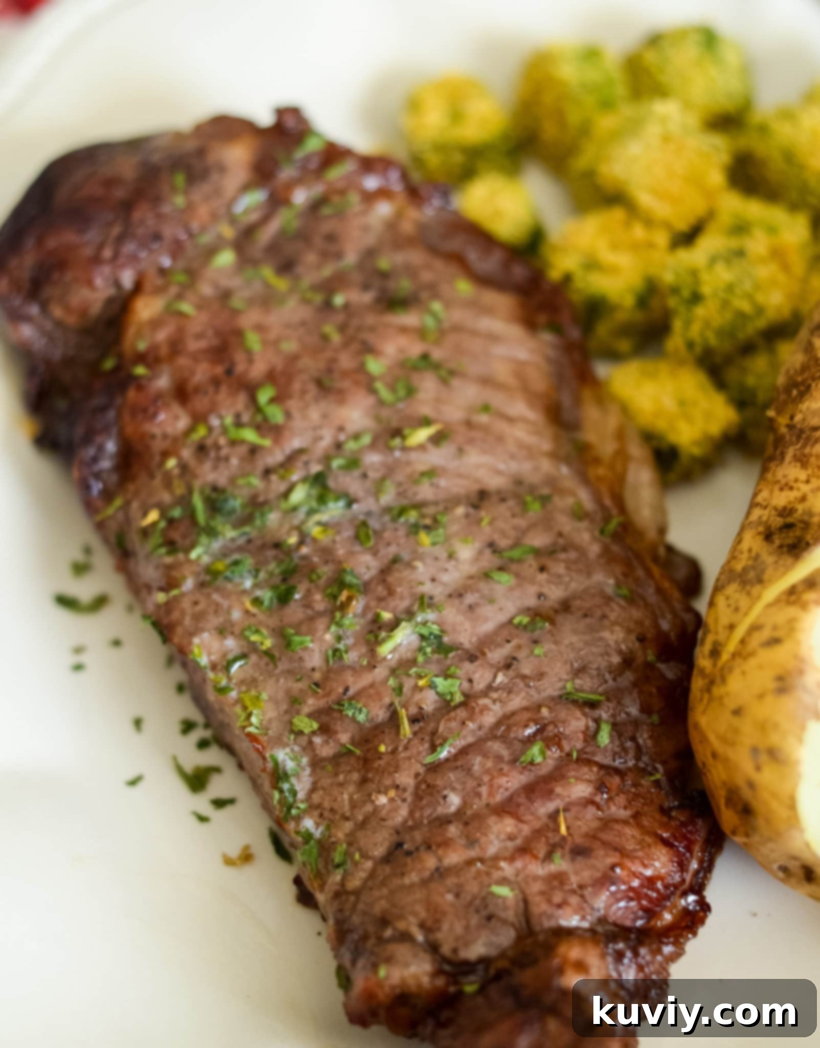 Air Fryer Garlic Butter Steaks with golden crust and melting garlic butter