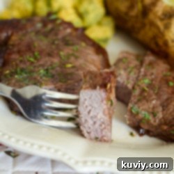 Air Fryer Garlic Butter Steaks with garlic butter melting over them
