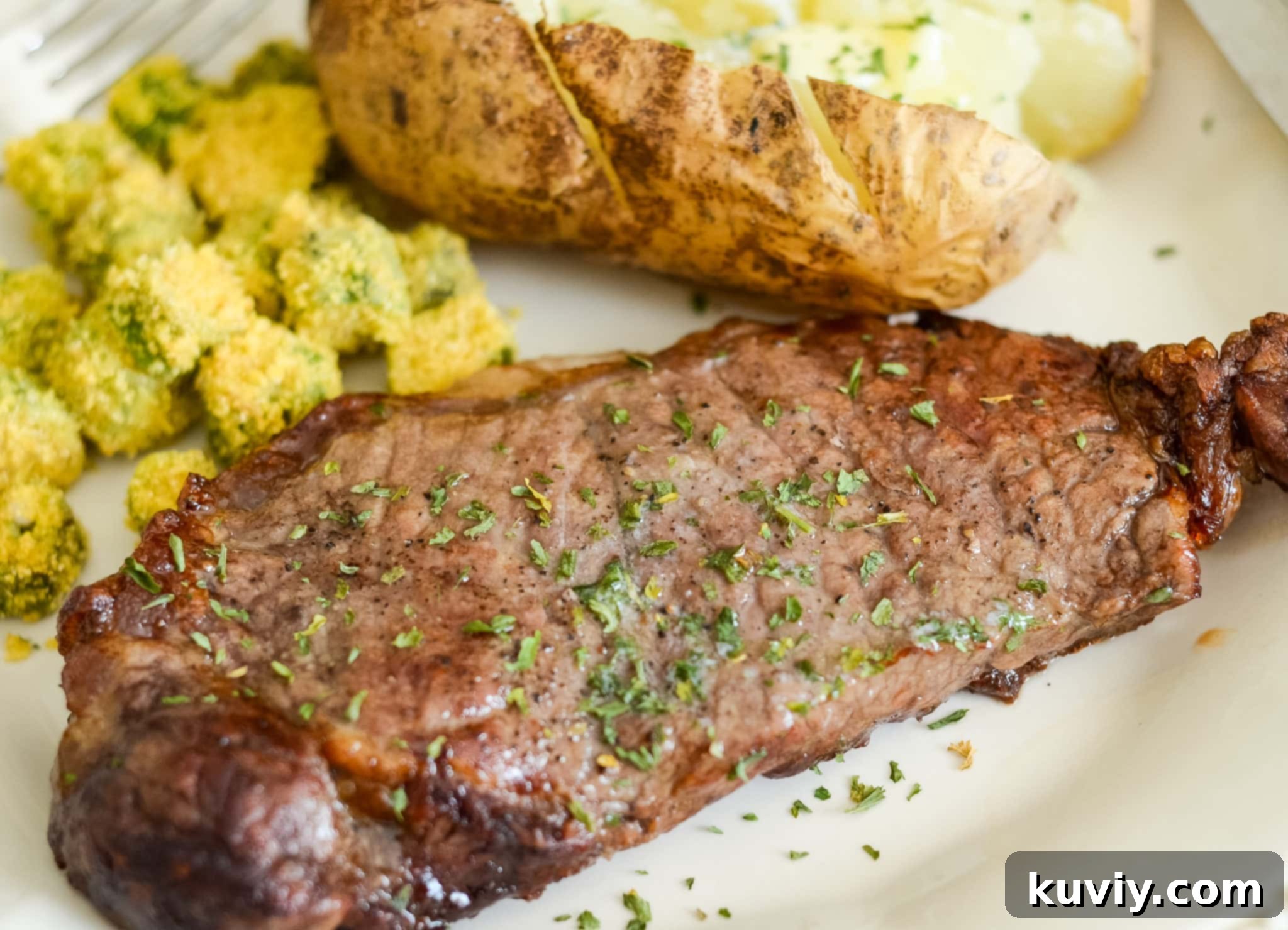 Close-up of a raw Air Fryer Garlic Butter Steak before cooking