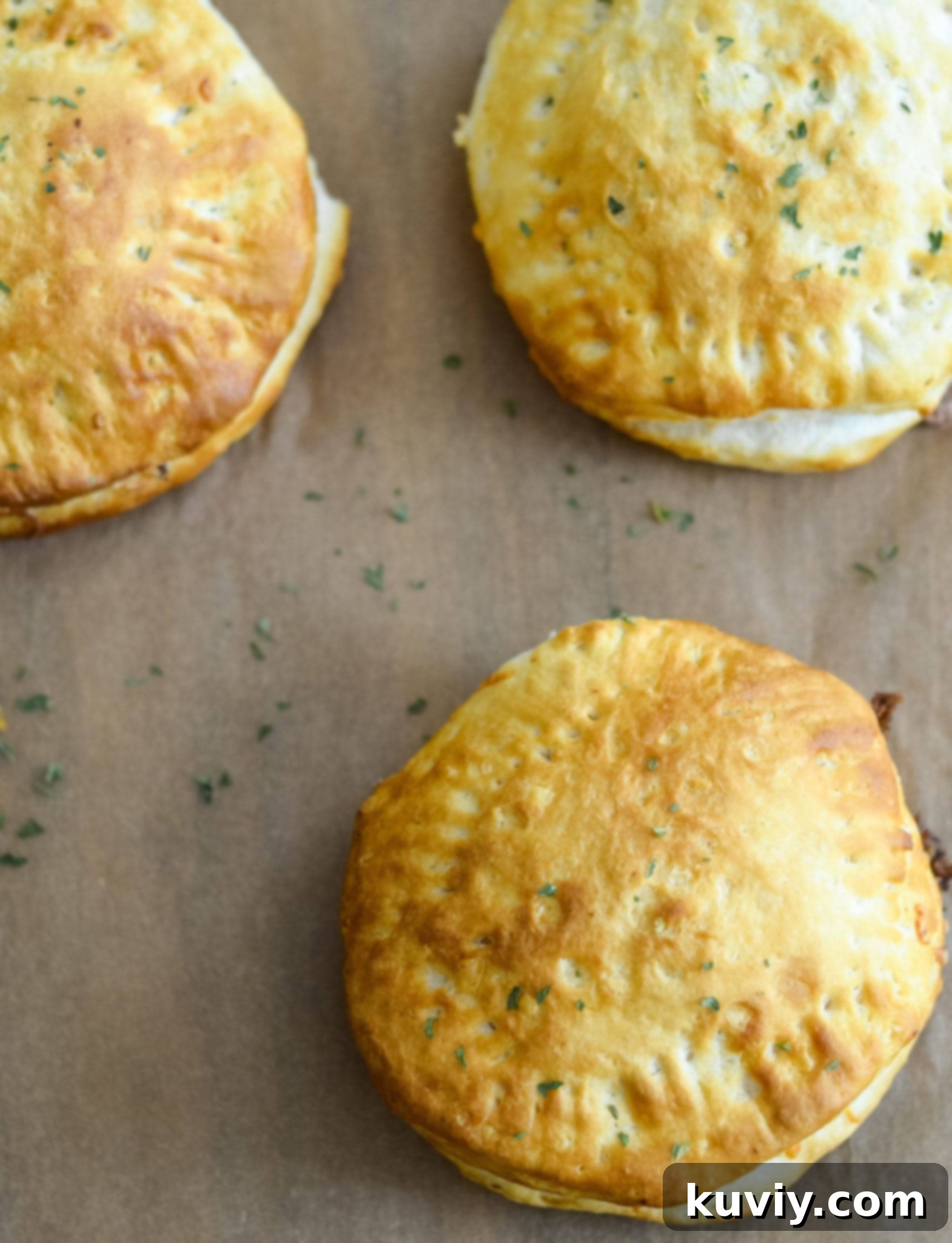 Two Air Fryer Cheeseburger Pockets cooking in an air fryer basket