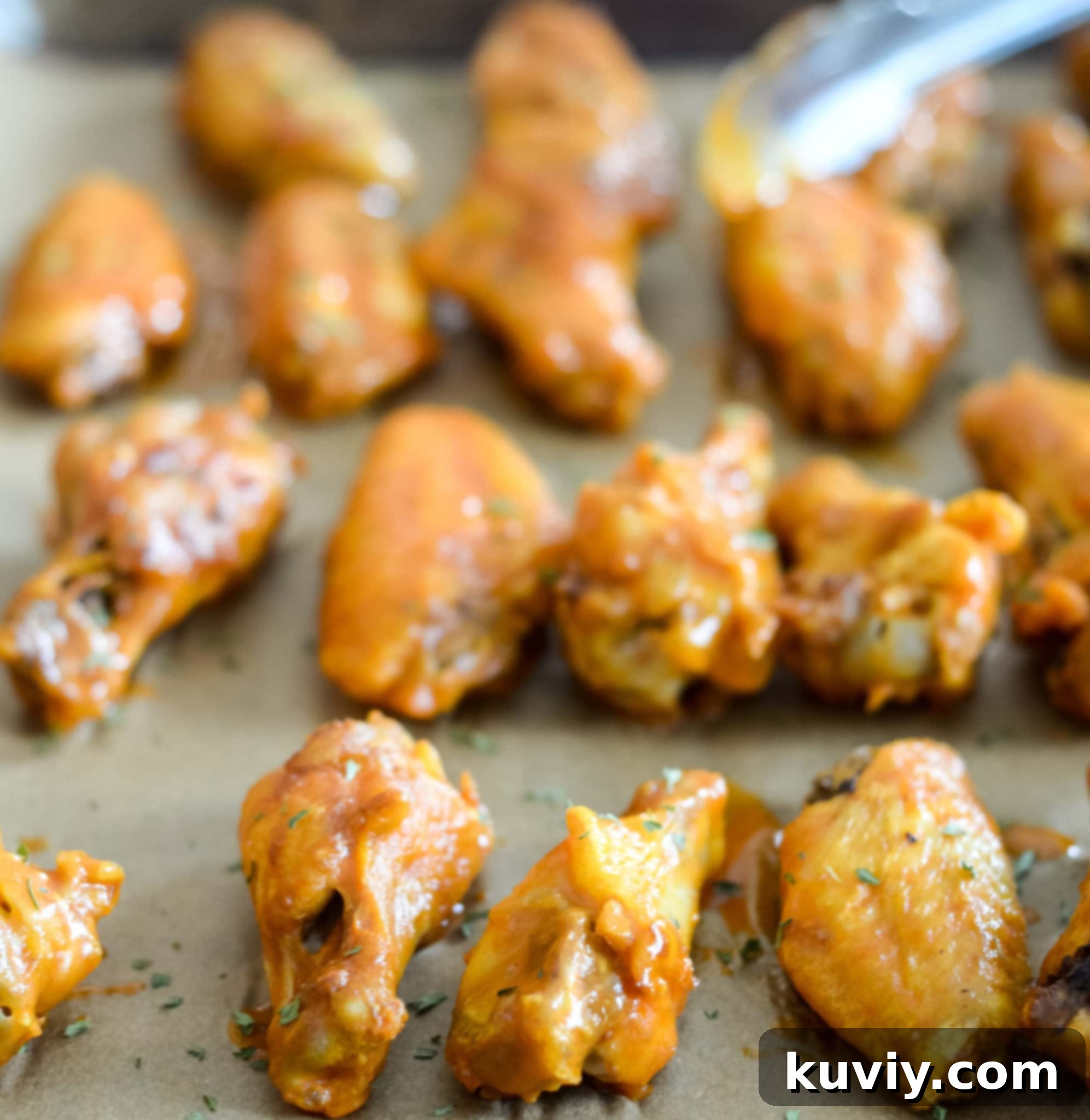 Air Fryer Buffalo Wings cooking in basket
