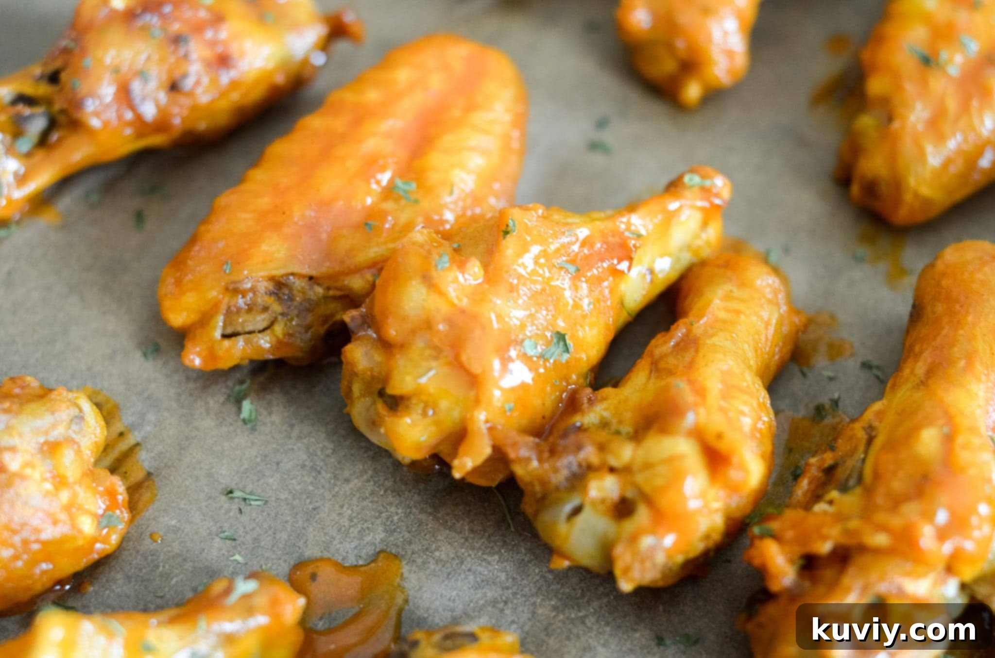 Air Fryer Buffalo Wings resting on a sheet pan