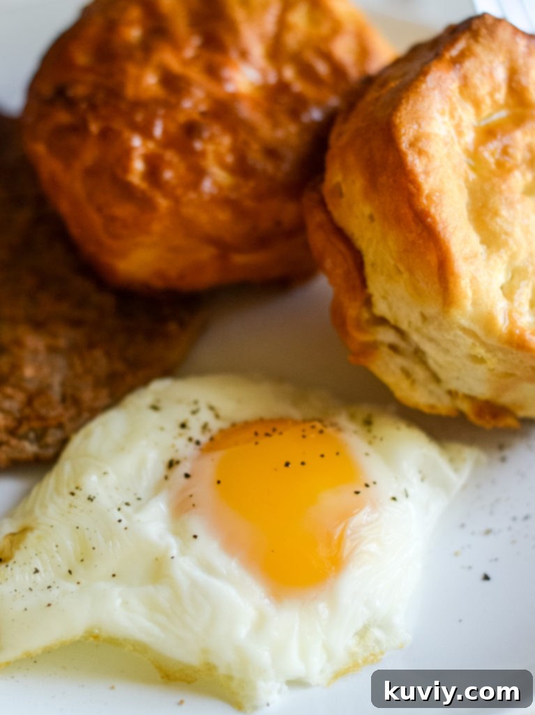 Air Fryer Eggs 2 Perfectly Air Fried Eggs with bright yellow yolks, ready for a healthy breakfast