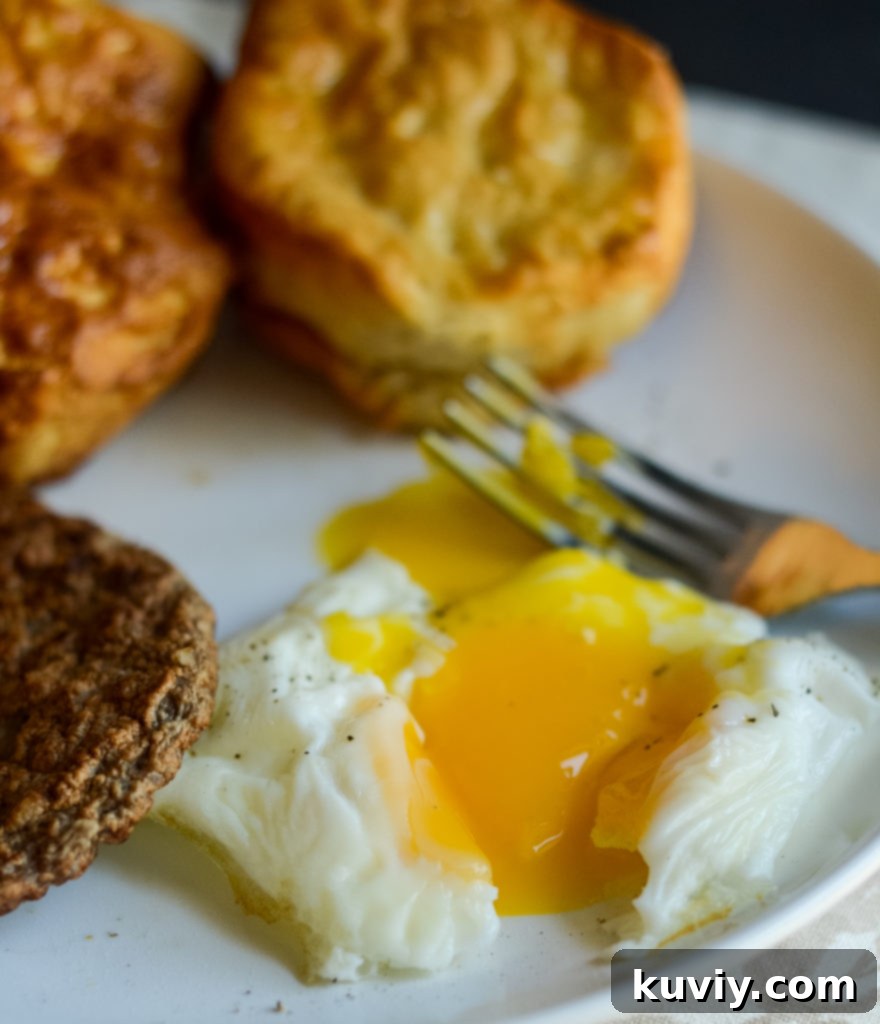 Air Fryer Eggs 4 Close-up of a perfectly cooked air fried egg in a white ramekin, ready for seasoning