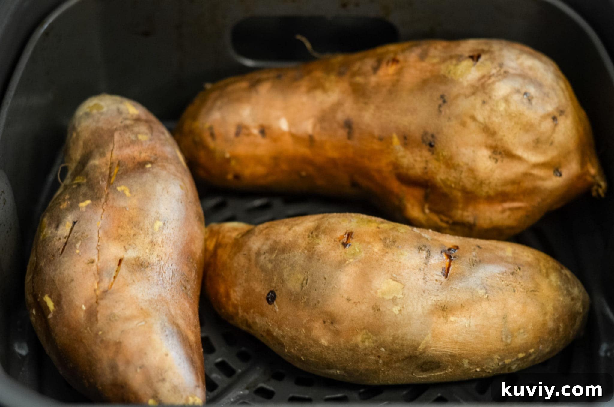 Close-up of air fryer sweet potatoes showing the golden skin