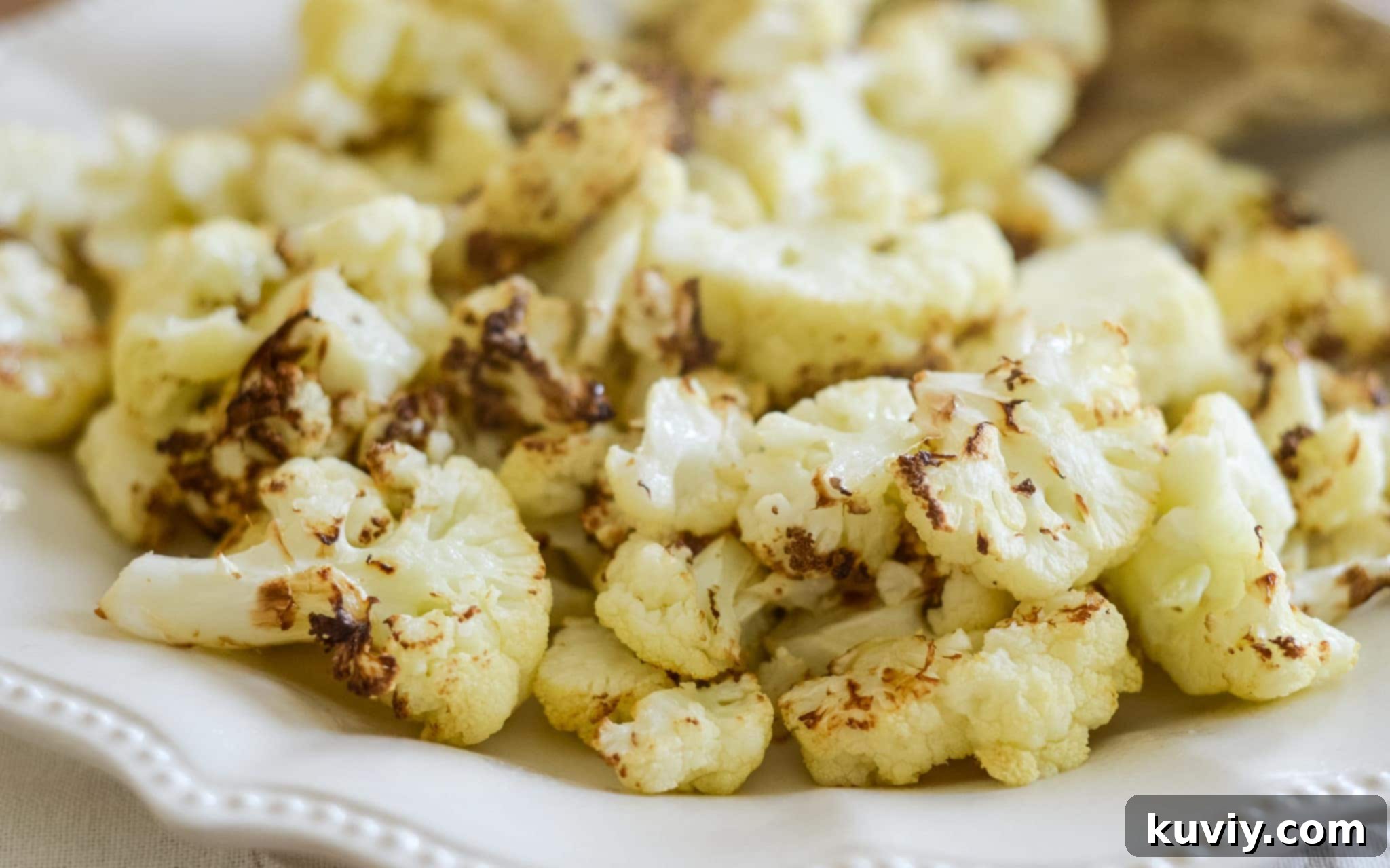 Air fryer roasted cauliflower served on a plate