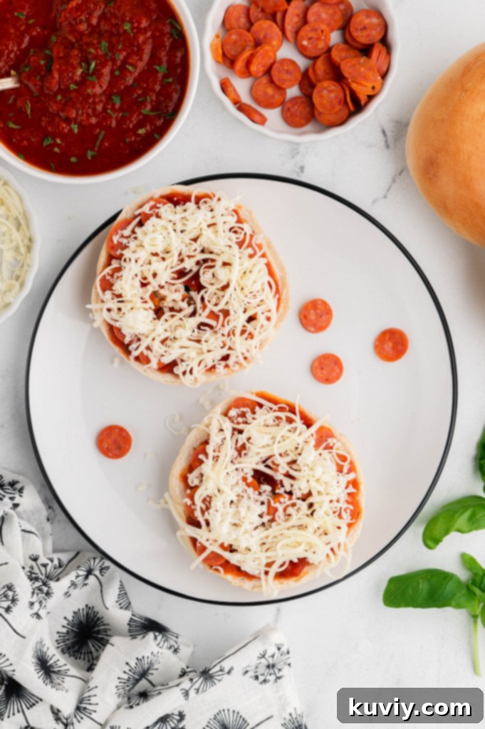 Close-up of freshly air-fried pizza bagels with bubbly melted cheese and pepperoni