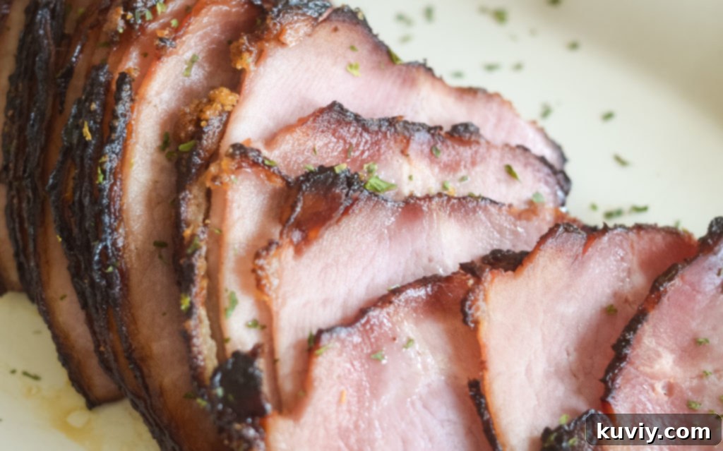 Air Fryer Brown Sugar Glazed Ham 3 air fryer ham slices on a cutting board