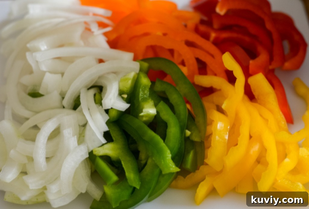 Fresh bell peppers and onions, key ingredients for vibrant air fryer fajitas.