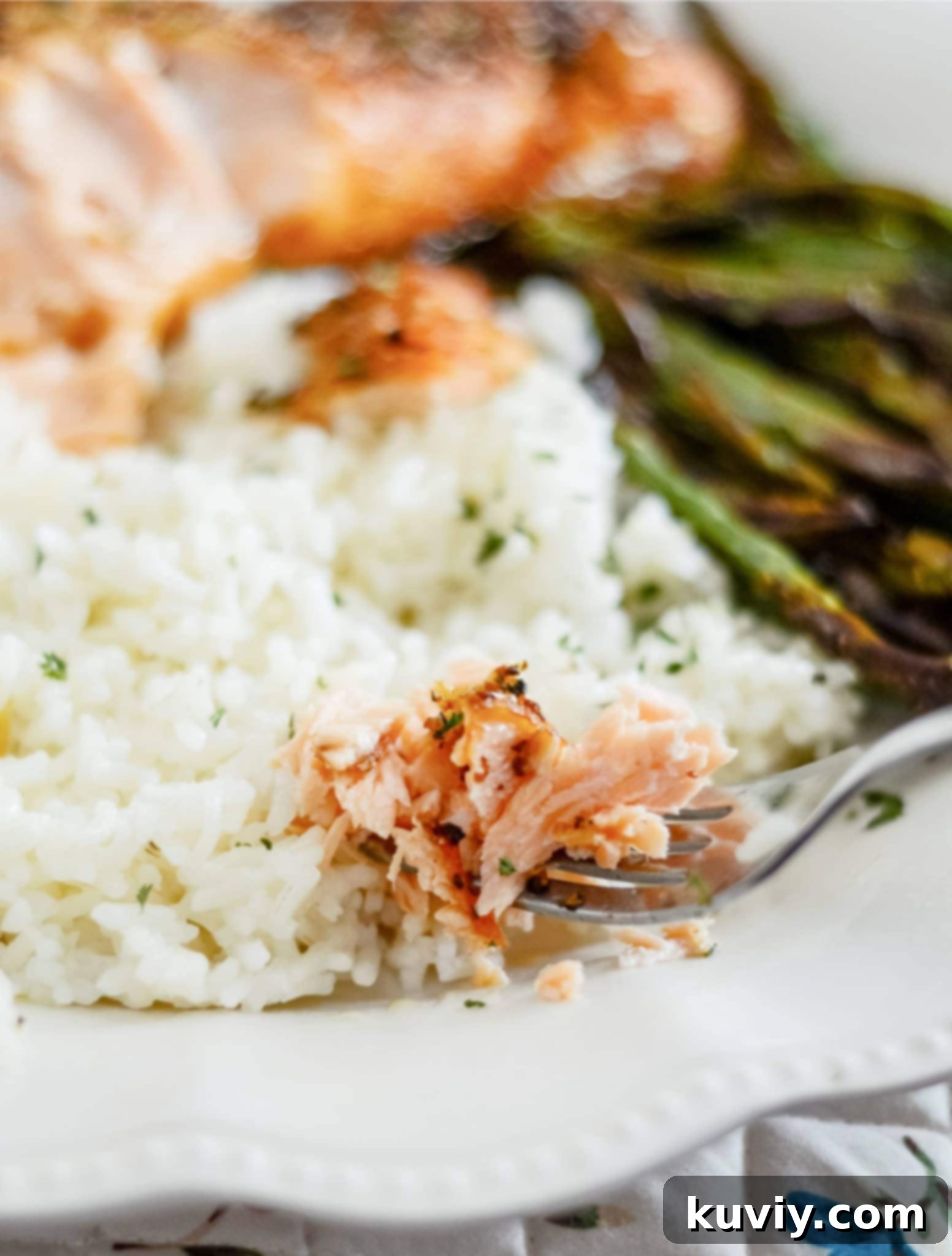 Perfectly cooked air fryer salmon garnished with fresh lemon