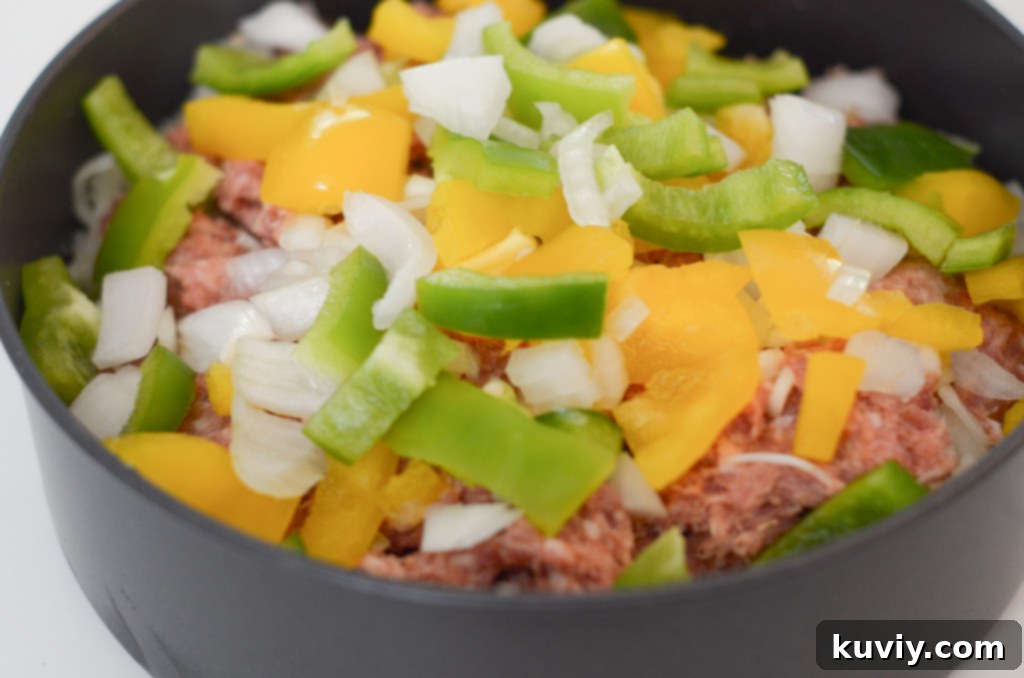 Air Fryer Sausage Breakfast Casserole ingredients in a pan