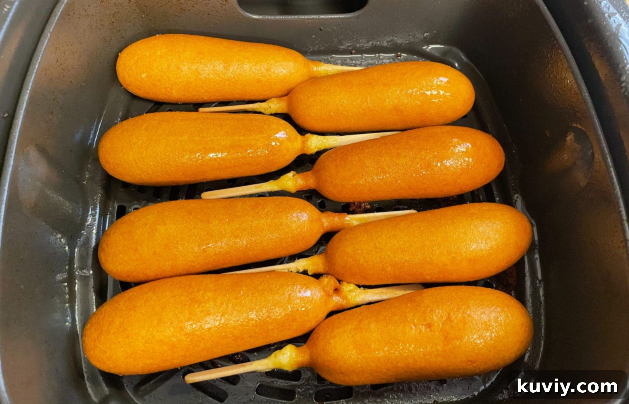 Crispy Air Fryer Frozen Corn Dogs 3 corn dogs in the air fryer