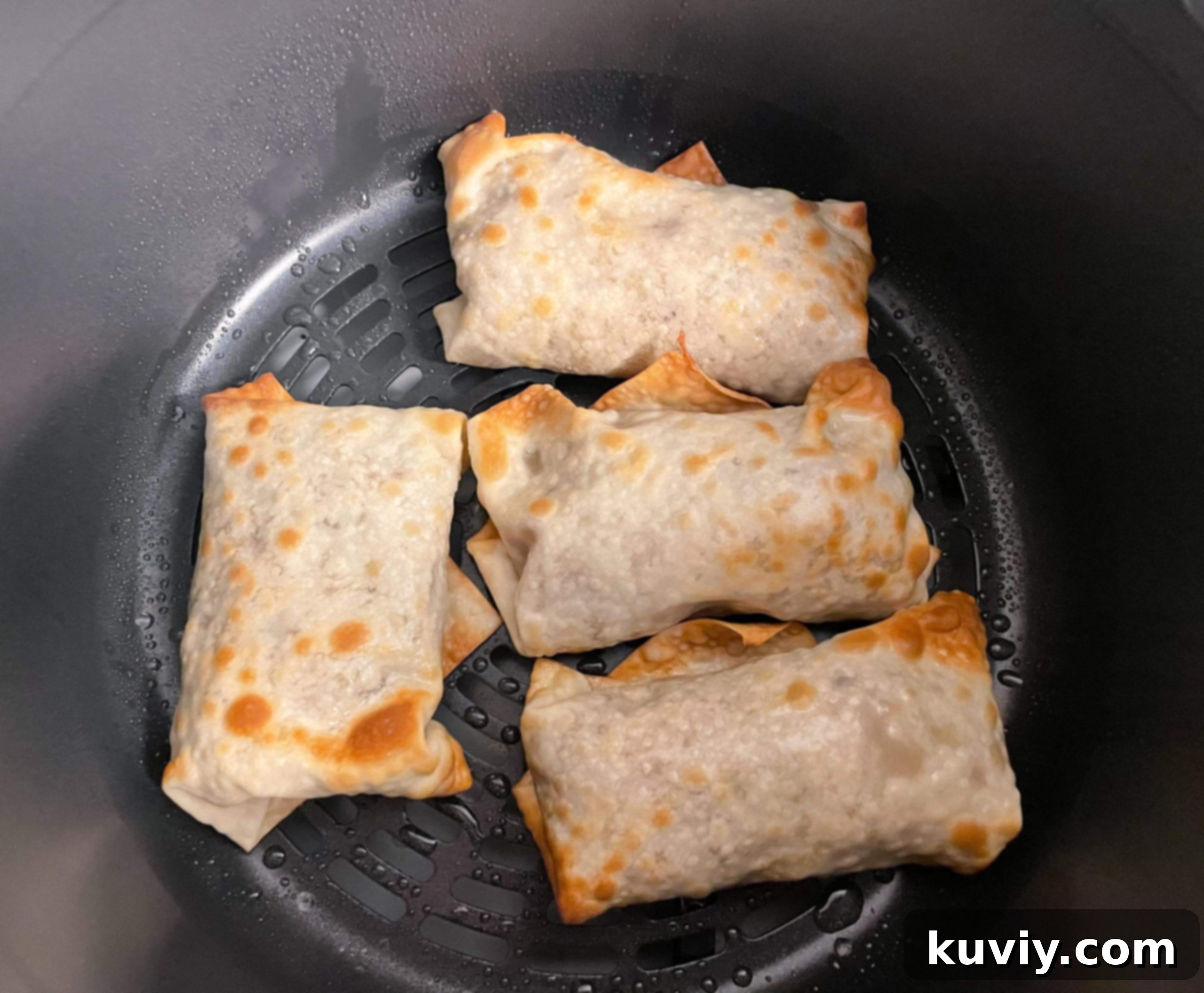 Ninja Foodi Air Fryer Egg Rolls 5 Ninja Foodi egg rolls being cooked