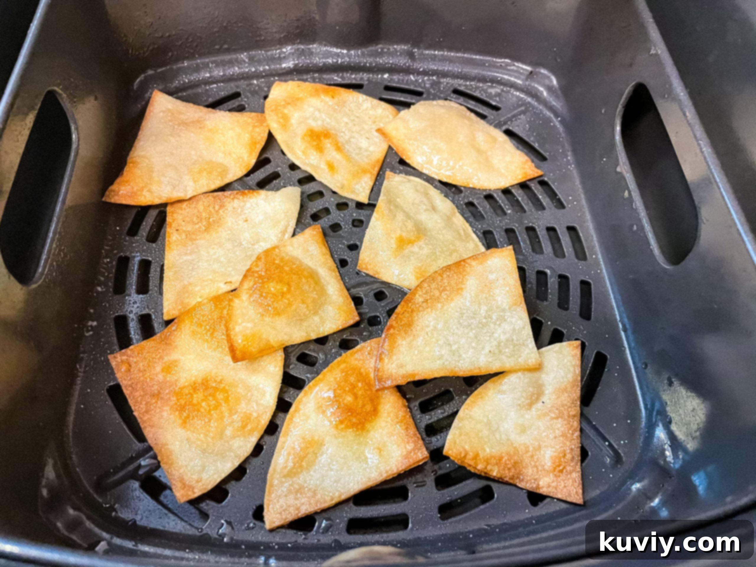 tortillas being cut into chips with a pizza cutter