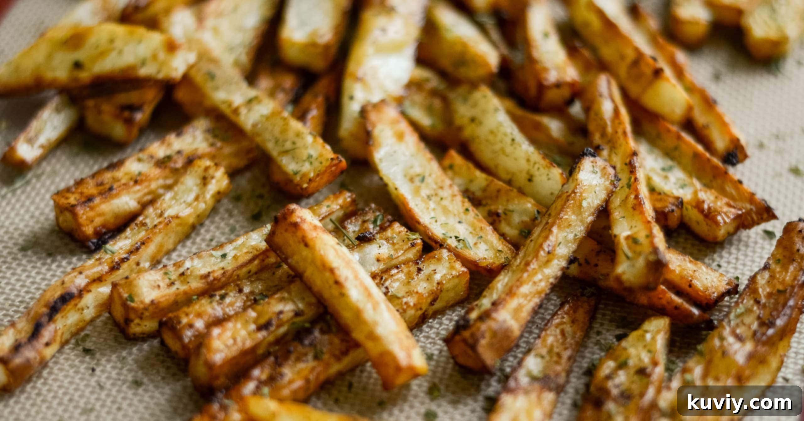 close up of air fryer french fries cooking