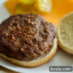 The Ultimate Air Fryer Turkey Burgers 7 Air Fryer Turkey Burgers on a bun with toppings.