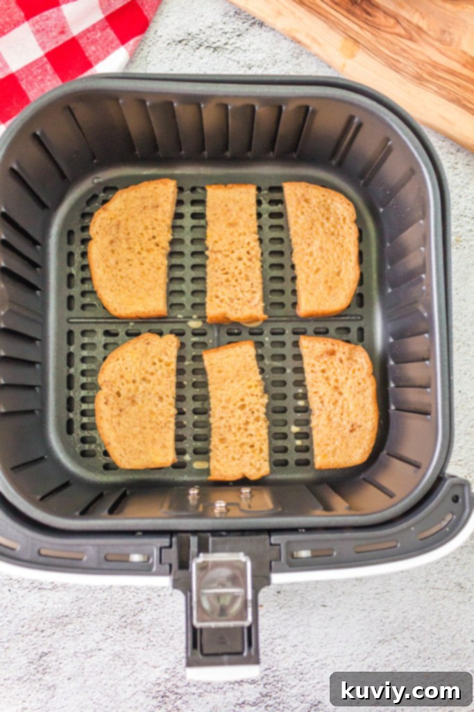 air fryer pumpkin french toast sticks in air fryer basket