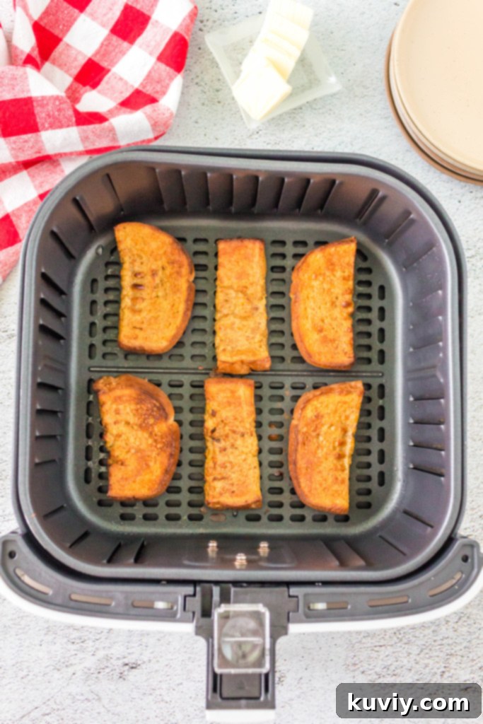 air fryer pumpkin french toast soaking in egg mixture