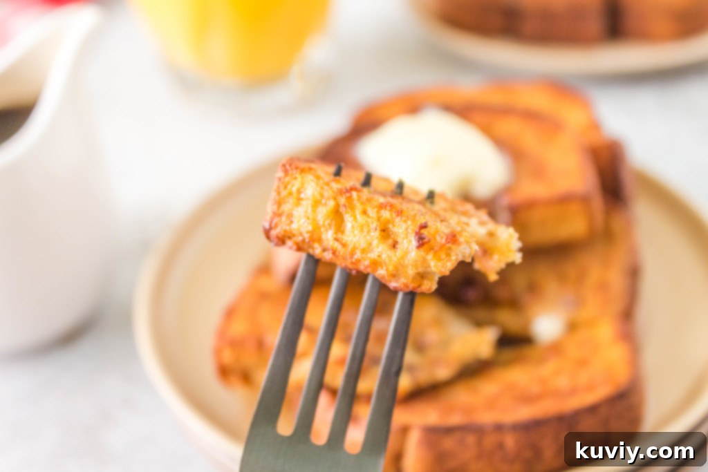 air fryer pumpkin french toast served with syrup and sausage