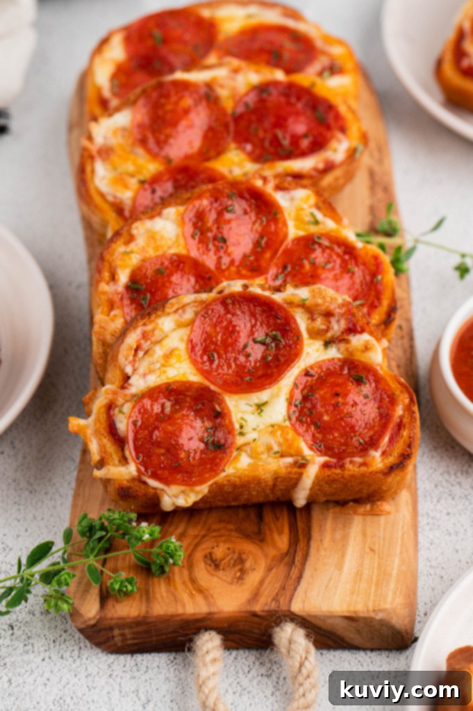 Crispy Air Fryer Garlic Bread Pizza Toast topped with pepperoni and melted mozzarella