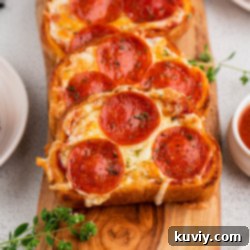 Air Fryer Garlic Bread Pizza Toast on a white plate