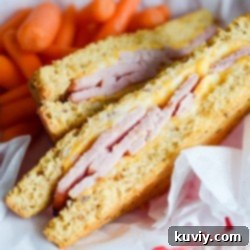 Crispy Air-Fried Ham and Cheese Melts 2 A perfectly golden brown air fryer ham and cheese sandwich, sliced in half
