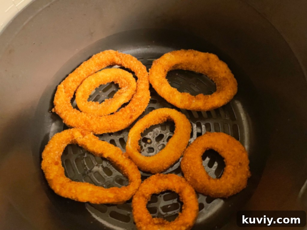 Close-up of golden brown air fryer frozen onion rings