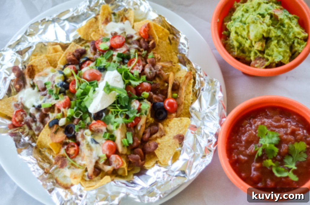 Crispy Air Fryer Nachos 5 Generous plate of air fryer nachos with various toppings